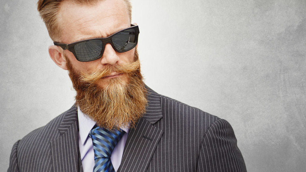 Bearded man in suit and sunglasses