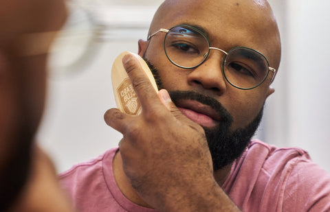 Update TT: Top 6 Reasons Why You Should Grow a Beard  OLD URL: https://thebeardclub.com/blogs/beard-culture/why-you-should-grow-a-beard  NEW URL: /should-i-grow-a-beard  Meta: Beards can make you look like a man, but if that’s not enough to convince you, maybe these six reasons will convince you to grow that goatee.  Top 6 Reasons Why You Should Grow a Beard Whether or not you grow some facial hair is a pretty personal decision that reflects your own style and personality. But while we’re admittedly a little biased, we happen to think that any guy can look their best when they let their beard flourish. Many a man dreams of that illusive full beard or epic sideburns but doesn’t quite know where to start or why their neckline needs a new do’.  If you’re still on the fence about the follicles on your face, here are some of the top reasons why we think you should let your beard grow to new lengths.  1. Beards Keep You Warm You probably wouldn’t go outside in shorts and a tank top when there’s snow falling from the sky. In fact, you’d probably be bundling up with some winter coats and long pants. Besides the baklava face covering you wear while snowboarding, you can grow your own face sweater. That’s right — a beard.   Beards add a layer of warmth to cover your skin, especially during cold climates. Men with fuller beards tend to be a lot more cozy and snug in the cold, thanks to the insulation provided by their natural coats.  This is probably why you always see Vikings sporting long, luscious beards — to protect themselves from the cold, wintry climates around them. While you might not need this in sunny LA or tropical Madagascar, you’ll still probably be thankful for your beard in the freezer section of your grocery store.  2. Beards Boost Your Confidence When you think of celebrities that tend to round out the “Sexiest Men Alive” categories, lots of them have one thing in common: facial hair. This might even be due to science. Studies have found that women were more likely to rank heavily stubbled faces as attractive compared to a clean-shaven look.  Now, there’s a lot more that goes into your attractiveness outside of your physical appearance. But if you start to sport a new beard, people might start to take notice and be a little bit more likely to ask for your number.  This might all be because beards are able to help contour your face shape with clippers and a trimmer. Many beard styles are able to chisel out your jawline or make your face appear wider, smaller, or whatever type of look you’re going for. So why not give it a go? Worse comes to worst, you don’t like it, and you can simply shave it off.  3. Beards Protect From Sun Damage Beards have some aesthetic benefits, but there might actually be some real health benefits to having one. Your beard might be able to protect your skin from harmful UV rays from the sun because of its reflectiveness and thickness.  Thicker beards will offer more protection from radiation damage or sun damage, but either way, it’s almost like you’re wearing some natural sunscreen on your chin, cheeks, and upper lip. Some rays can still get through your epic beard hairs, but beards can help to scatter the light and protect against sun damage.  While it’s no replacement for using some real sunblock, you can feel a little bit more secure when you’ve got a bushy beard to keep you shaded.  4. Mustaches Can Help Filter Air Men who have beards, specifically mustaches on their upper lip, might actually be able to filter out allergens and other particles from entering the nostrils. Things like pollen or dust can get caught in your upper lip instead of entering your nasal cavity, which can cause an allergic reaction in some cases.  5. Beards Cover Imperfections Look — you’re handsome. We know it. You know it.   But sometimes, some new hair can cover a pimple or two, and that’s nothing to knock. Acne is a condition that affects millions of people worldwide, and it can result in some unsightly blemishes on the face. While there are some treatments, these can often take a long time to actually work properly.  In the meantime, you can cover up some of those blemishes by just blocking them out with your beard. Your facial hair can naturally cover up acne, blackheads, whiteheads, scars, and other imperfections that might otherwise lower some of your sense of confidence. PS: Make sure to keep up with your skincare routine.   6. Beards Keep Skin Hydrated Completely shaving your beard can dry out your skin, which can lead to wrinkles, dandruff, or flaking on your skin’s surface. But when you grow a beard, the natural oils on your skin and hair are able to maintain a healthier complexion.  While you should moisturize your beard and your skin no matter what, having a beard can lessen some of the labor that you need to put in. That’s especially true when you’re using the right beard products, like our Sandalwood Beard Oil, for helping to grow a well-nourished longer beard.  How To Grow a Beard After reading all of the benefits, you’re probably ready to grow your beard to Dumbledore extremes, but some guys have a little bit of trouble getting past the stubble.  If that’s you, here are some tips and tricks to help make your beard fuller and healthier.  Use the Right Products What you do in your beard care routine is important, but the products you use might be even more necessary. You want to use high-quality products that are specifically formulated with your beard health in mind — kind of like what you’d get from us here at The Beard Club.  If you don’t know where to start, we’ve got you covered with our Beard Growth Kits. These are chock full of everything you’ve ever needed to start growing your beard or maintain your beard health for years to come. With things like beard oils and derma rollers, you’ll be seeing more growth than ever before.  Plus, each comes with our signature PT45 Beard Trimmer with 45 unique trim settings, a 7,000 RPM Motor, three-hour battery life, and top-quality titanium-coated ceramic blades. It’s the result of years of research and development, now in the palm of your hand to help you achieve your perfect beard look.  Eat a Balanced Diet A healthy diet can have loads of benefits throughout your entire body. It can support your muscles and boost immunity, strengthen your bones, and even lower your risk of heart disease. But it can also help you grow a healthier, fuller beard.  Facial hair growth is propelled mostly by testosterone, a hormone that has varying levels throughout men. Having low testosterone levels can impact beard growth, as well as other important processes in your body. But you can supplement testosterone by eating right, especially because obesity has been shown to lower testosterone.  Foods like whole grains and other carbs, healthy fats, nuts, and chickpeas high in zinc, as well as fruits and veggies, are all important to incorporate as a part of your healthy diet. If you need a little boost, Beard Growth Vitamins specifically targeted toward beard growth might prove handy.   Wash Your Face While beards can cover your acne and blemishes, they can only do so much for so long. This is because if you don’t wash your face, your beard health can easily start to suffer. When oils and dirt on your skin clog your pores, it can affect your hair follicles. This might make it more challenging to grow a thick, luscious beard.  Speaking of skin, maybe you’re not sure how to get past the itchiness stage. Hint: The right products like Beard and Face Wash, a toner, a moisturizer, and some good old-fashioned time help that itch disappear.   Follow up your wash with a Beard Brush to banish those dead skin cells and keep the beard smooth and sleek.   In Conclusion Growing a beard isn’t for everyone, but if you’ve been on the fence about it, there are plenty of reasons why you should just go for it. Among them are aesthetic reasons, like the fact that beards can make you more attractive and cover blemishes. There are also health reasons why having a beard is good, like protecting you from the cold or blocking out UV sun rays.  If you’re convinced but still have trouble, have no fear. You can promote healthy beard growth by eating the right foods, keeping your face clean, and using the right products. Using the right products starts by shopping from a retailer you can trust.  But at The Beard Club, we know a thing or two about beards. Join the club and discover your best beard by taking the quiz and getting your personalized beard plan.  Sources:  ScienceShot: Heavy Stubble Makes Men More Attractive | Science | AAAS  Are There Health Benefits to Having a Beard? | Piedmont Healthcare  Benefits of Healthy Eating | Nutrition | DNPAO | CDC  Obesity: Unhealthy and Unmanly | Harvard Health Publications  Beards and Lung Health: A Lung Health Expert Weighs In | American Lung Association