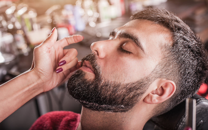 bearded man with eyes closed