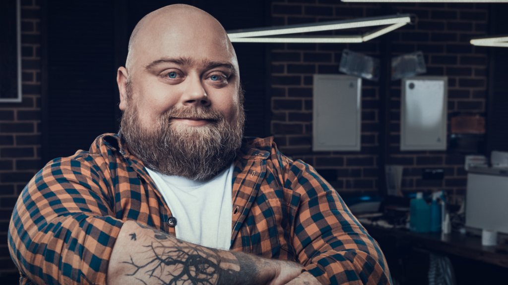 Bearded man with arms crossed